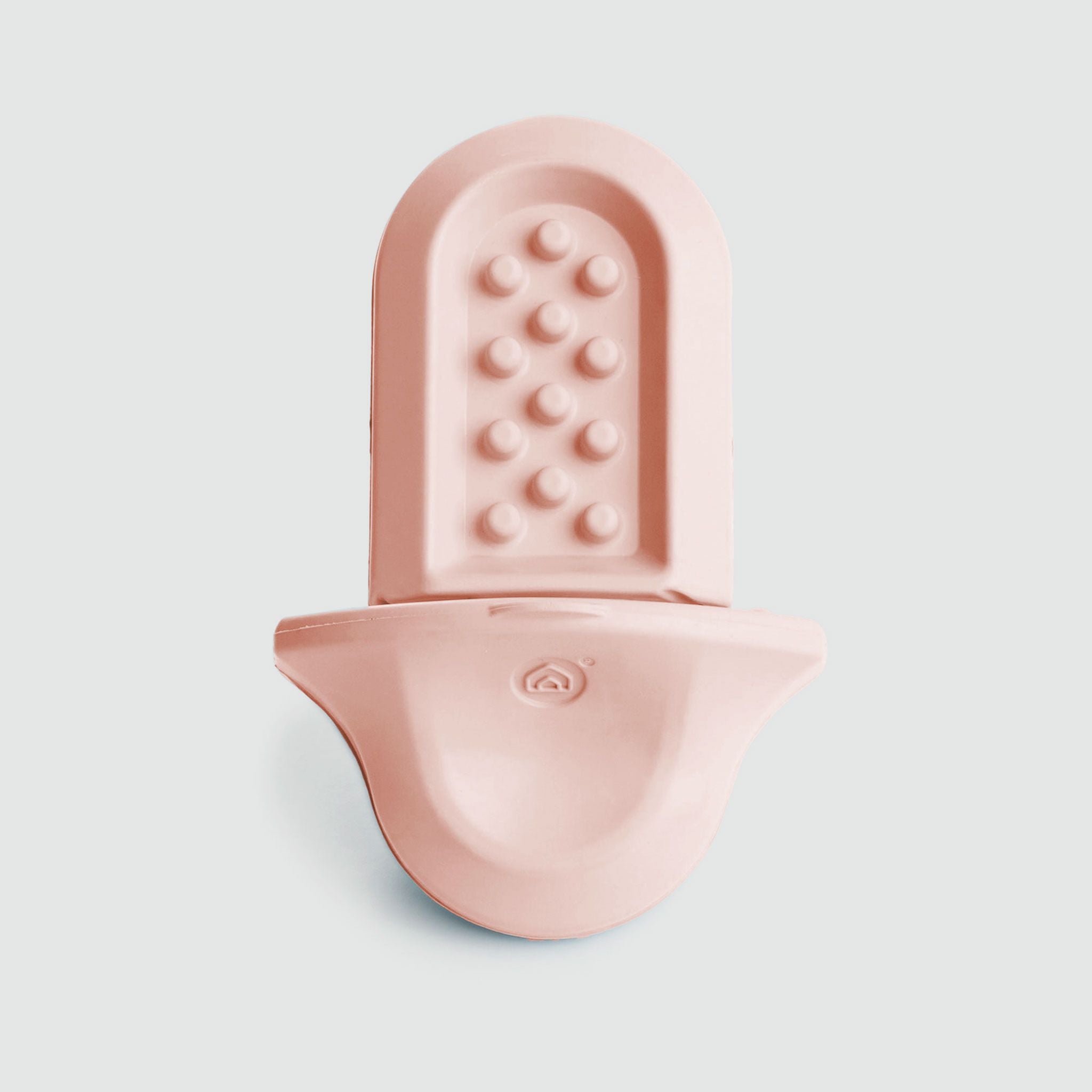 A close up of a pink Groov on a white background